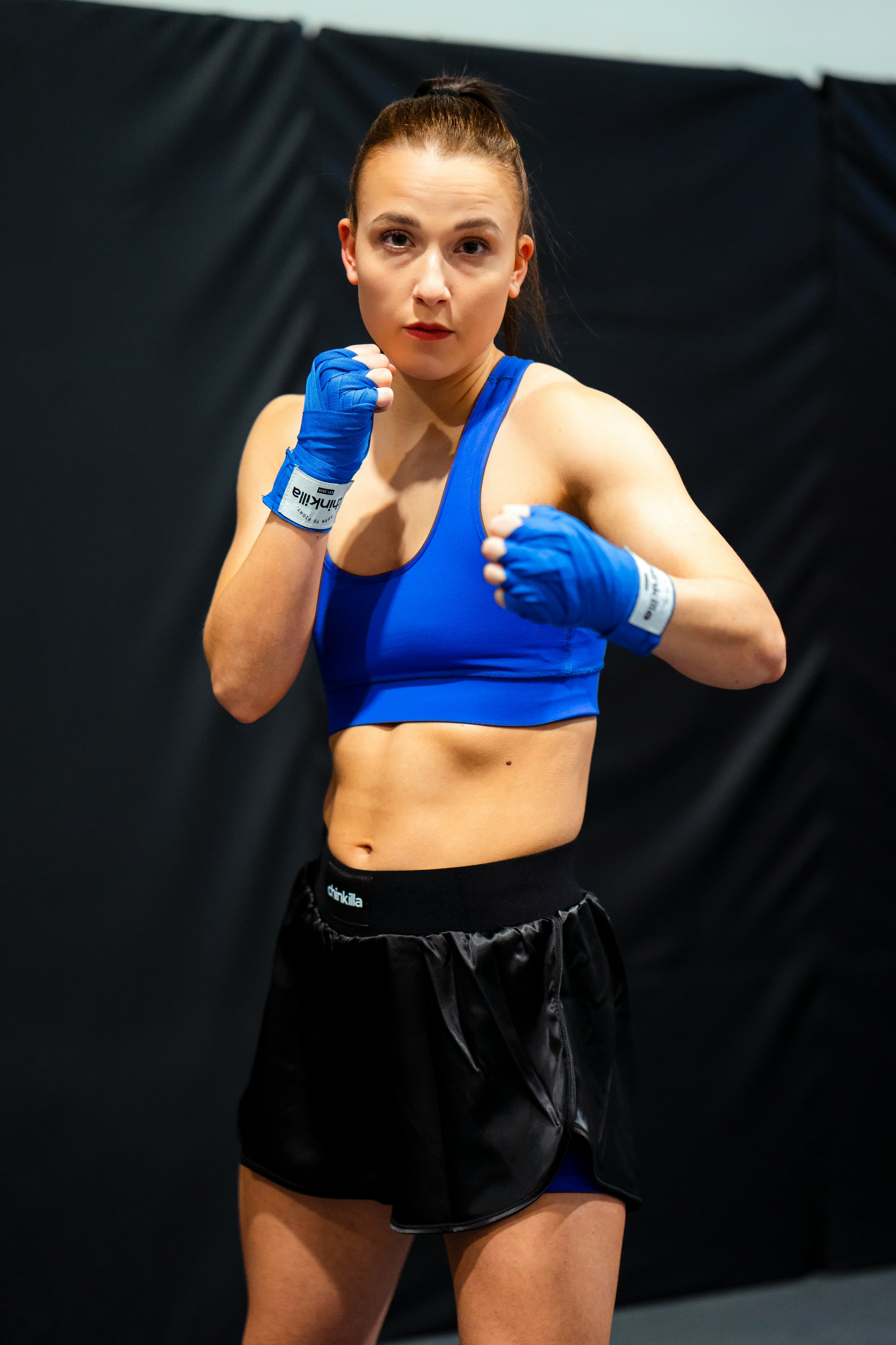 Emma Lopez - Yoga and Barre Instructor in boxing stance